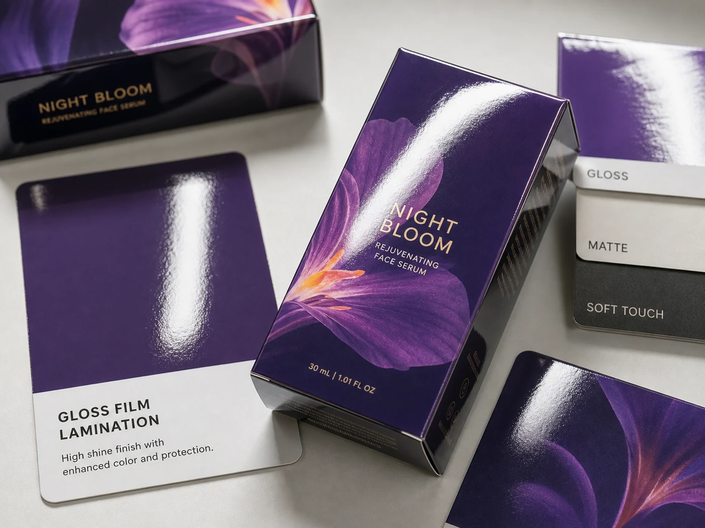 Gloss laminated packaging cartons and sample cards with reflective highlights and rich printed color