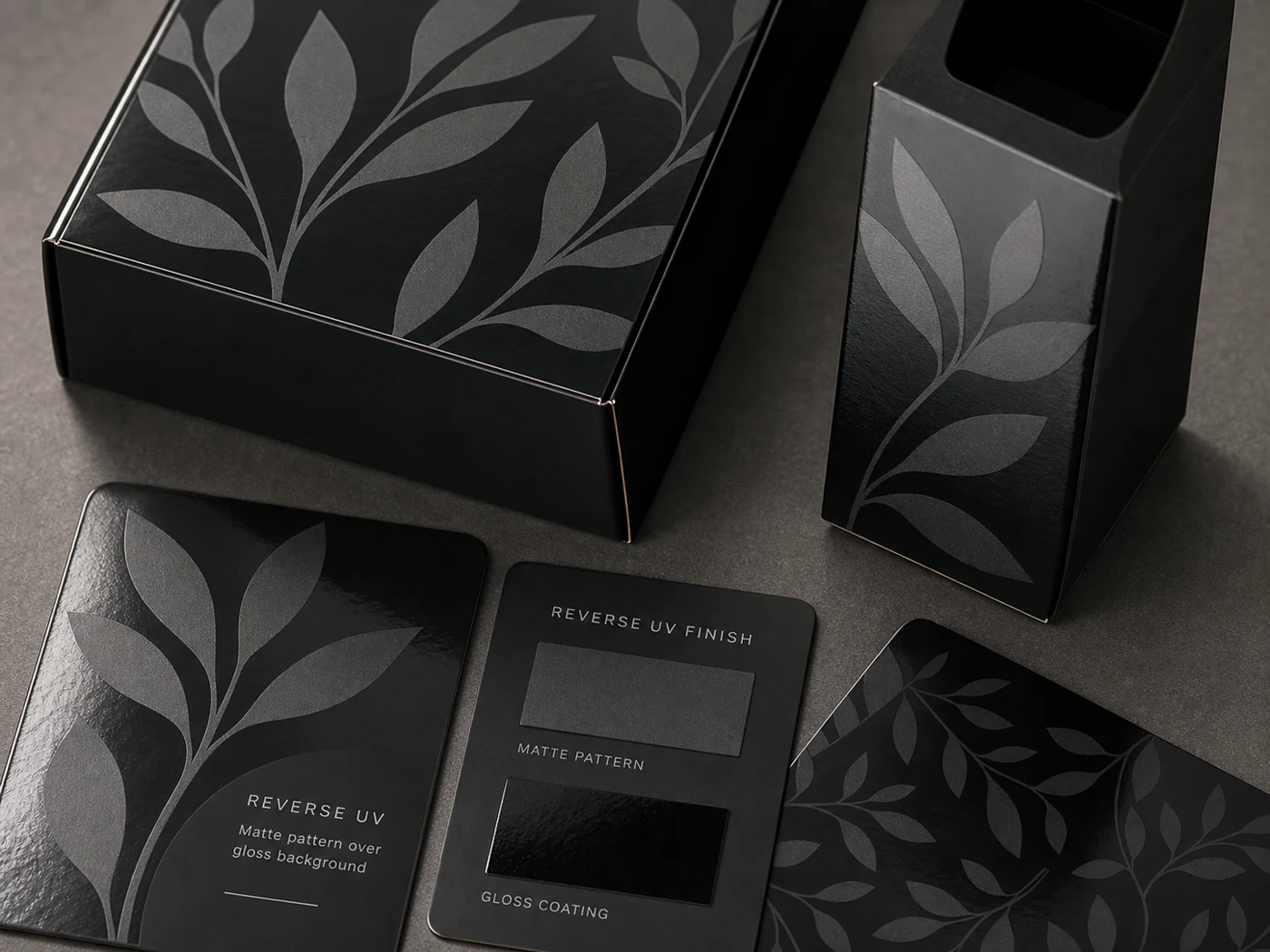 Reverse UV packaging proof with matte pattern and glossy coating contrast on paperboard samples